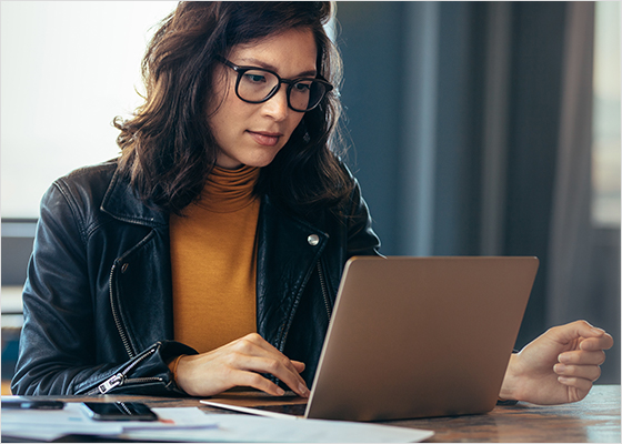 Woman working on her laptop.